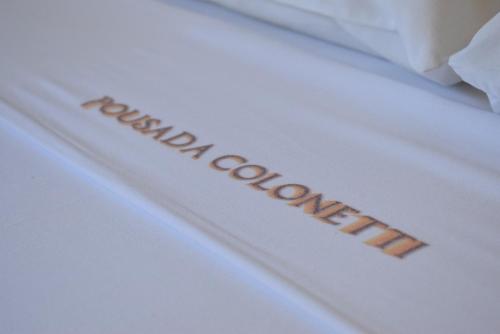 a white envelope with the word new contraceptives written on it at Pousada Colonetti in Lindóia