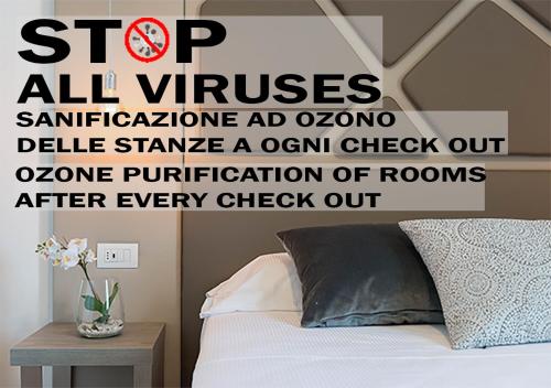 a sign that reads stop all viruses schizophrenia ad ozonealeenna ad ozone at Suite Deal in Rome