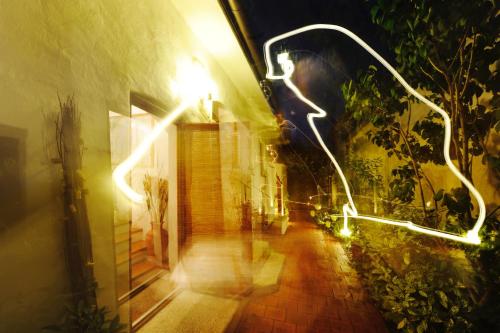 a person walking down a hallway at night at Casa.Peiso in Mörbisch am See