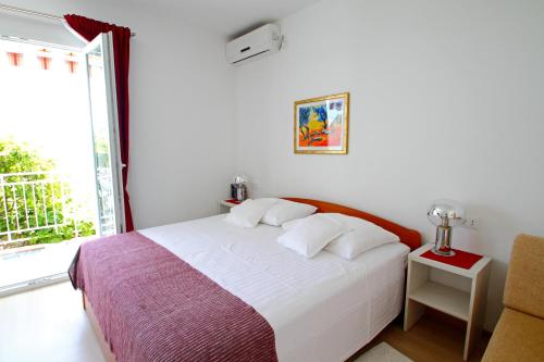Ένα ή περισσότερα κρεβάτια σε δωμάτιο στο Apartments Ante