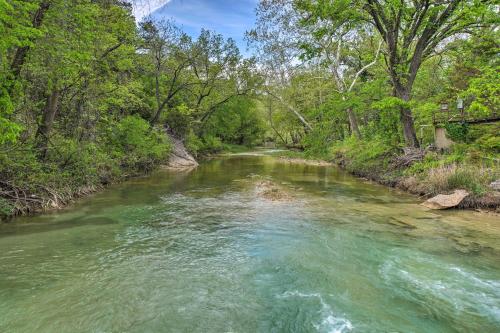 a river with green trees on both sides of it at Cedar Falls Cabin Nestled by Honey Creek in Davis