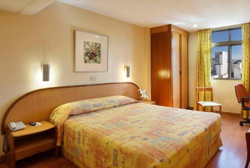 
Cama ou camas em um quarto em Windsor Guanabara
