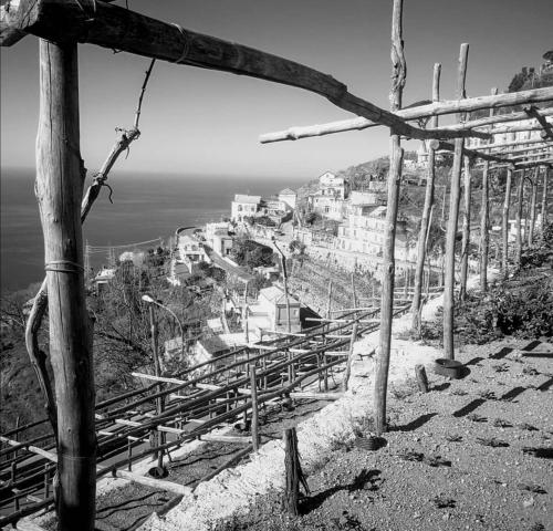 a black and white photo of a town on a hill at San Giacomo Relais in Furore