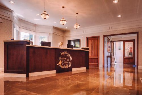 a lobby with a reception desk in a building at Hotel Jardins da Colina in Nova Petrópolis