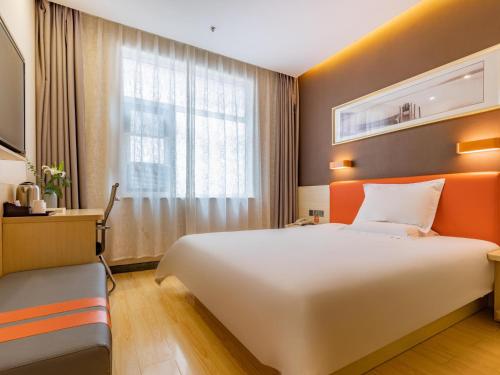 Ένα ή περισσότερα κρεβάτια σε δωμάτιο στο 7Days Premium Linyi Mengyin Mengshan Road Branch