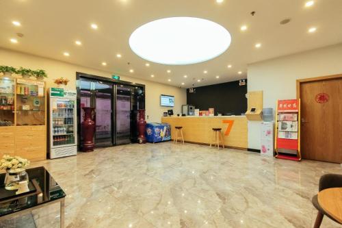 a large room with a store with a gas station at 7Days Premium Zhengzhou Songshan Road Rose Park Subway Station Branch in Zhengzhou