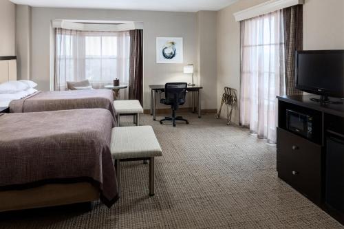 Ένα ή περισσότερα κρεβάτια σε δωμάτιο στο Park Place Hotel & Conference Center