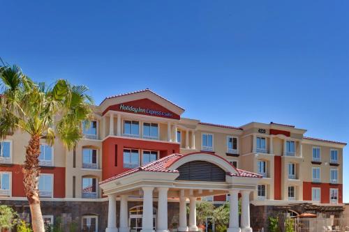 a large building with a large clock on the front of it at Holiday Inn Express & Suites Las Vegas SW Springvalley, an IHG Hotel in Las Vegas