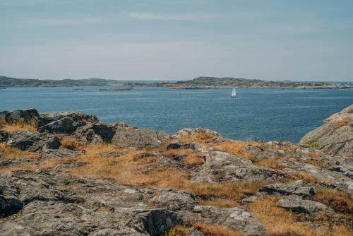 a sail boat in a large body of water at Grand Hotel Marstrand in Marstrand