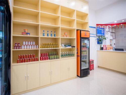 a store with a vending machine in a room at 7 Days Premium Jiangmen Diwang Plaza Branch in Jiangmen