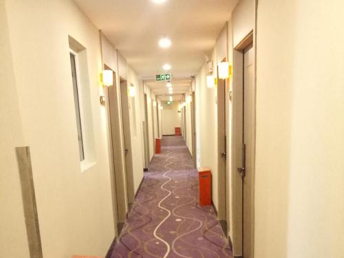 a corridor of a hospital with a long hallway at 7Days Premium Shangdi Tiyu University Branch in Beijing