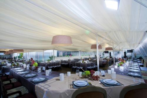 a large white tent with tables and chairs at Casa Grande Hotel Boutique in Morelia