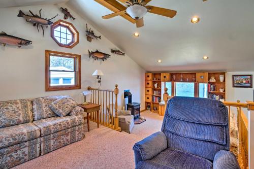 a living room with a couch and a chair at Waterfront Home on Lake George with Boat Dock! in Queensbury