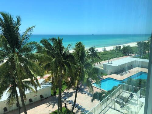 a view of the beach from the balcony of a resort at Ocean Front Units at Miami Beach in Miami Beach