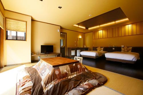 Llit o llits en una habitació de Hanare no yado Kamigakure
