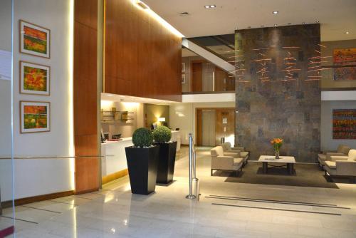 El vestíbulo o zona de recepción de Hotel Director Vitacura