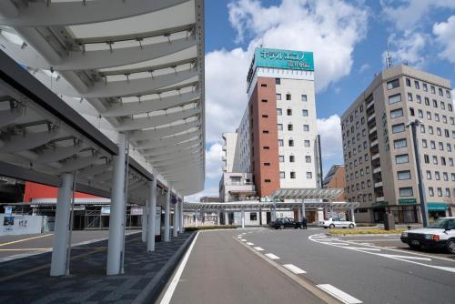 a view of a city street with buildings at Hotel Econo Fukui Station in Fukui