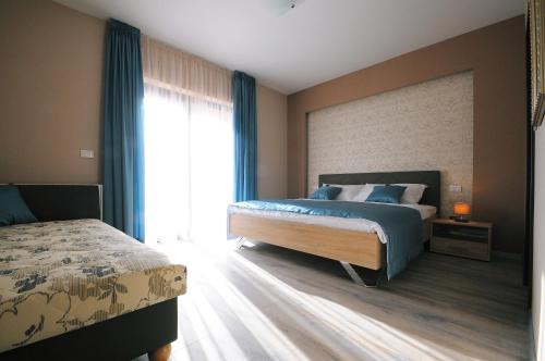 Postel nebo postele na pokoji v ubytování Villa Antonija