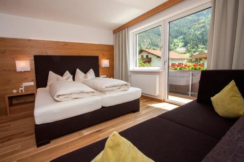 Кровать или кровати в номере Apartmenthaus Juen