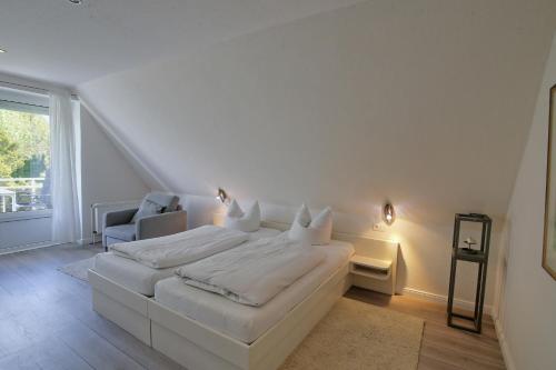 Postel nebo postele na pokoji v ubytování Landhaus Dreesen