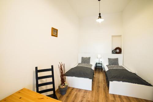 
Postel nebo postele na pokoji v ubytování Penzion Kroměříž
