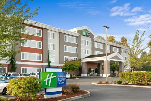 a rendering of a hotel with a sign in a parking lot at Holiday Inn Express Hotel & Suites Marysville by IHG in Marysville