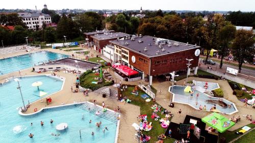 an overhead view of a swimming pool with people in it at Noclegi PAŃSKA Góra in Andrychów