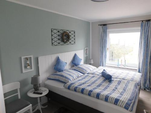 Postel nebo postele na pokoji v ubytování Ferienhaus-Steinburg