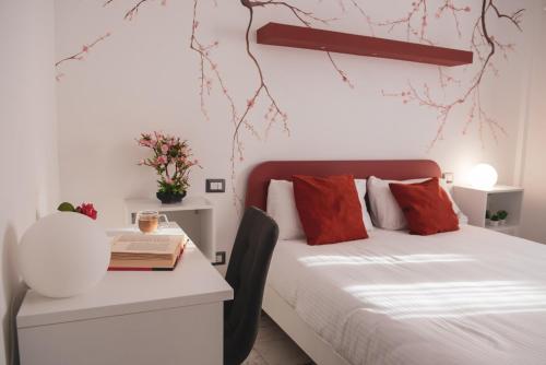 A bed or beds in a room at Elly's B&B