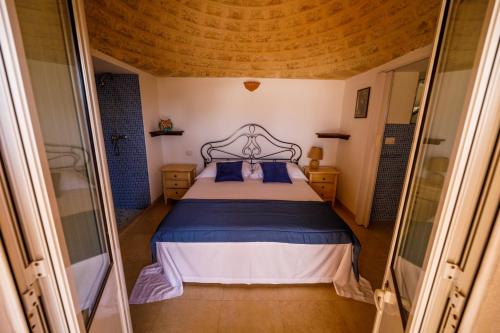 Callistos Trullo Torre Vadoにあるベッド