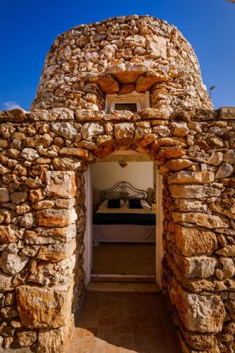 マリーナ・ディ・ペスコルーゼにあるCallistos Trullo Torre Vadoのギャラリーの写真
