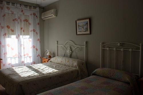 Llit o llits en una habitació de Hostal Casa Jose