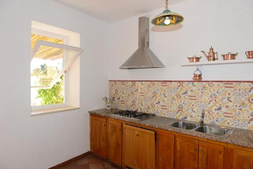 Η κουζίνα ή μικρή κουζίνα στο Casa Positamo