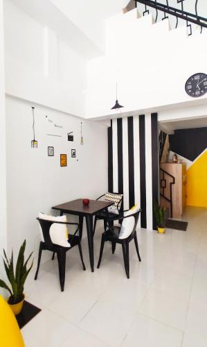 a dining room with a table and chairs at Nap at 265 Donmeaung in Bangkok