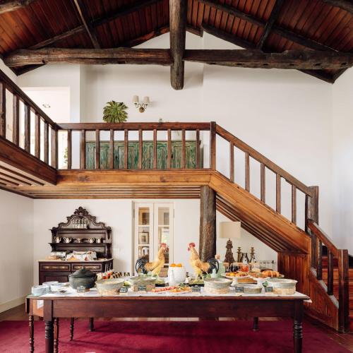 a table with food on it in a room at Quinta Nova Winery House - Relais & Châteaux in Pinhão