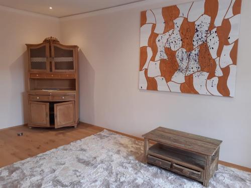 a room with a table and a painting on the wall at Wachau-Living in Dürnstein