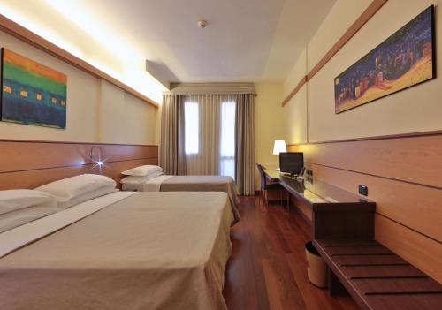 Postel nebo postele na pokoji v ubytování Best Western Hotel Dei Cavalieri