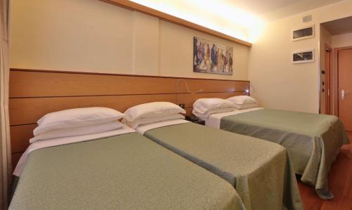 a room with two beds in a room at Best Western Hotel Dei Cavalieri in Barletta