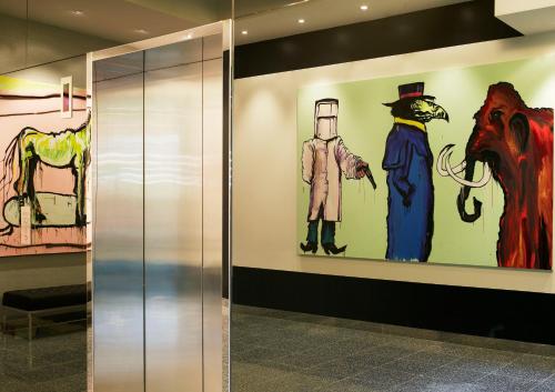 a hallway with paintings on the walls of a building at The Cullen Melbourne - Art Series in Melbourne