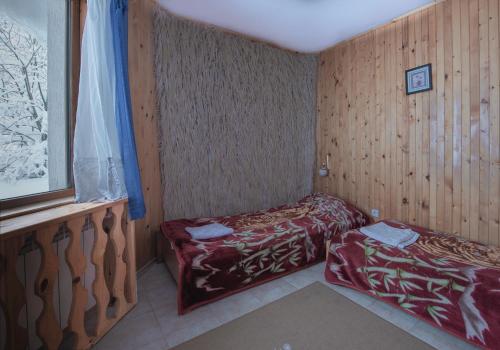 Postel nebo postele na pokoji v ubytování Hotel Elitza