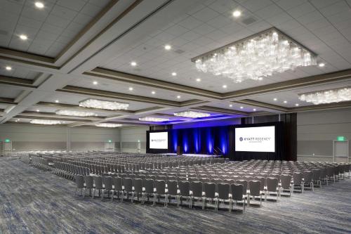 an empty lecture hall with chairs and a screen at Hyatt Regency San Francisco Airport in Burlingame