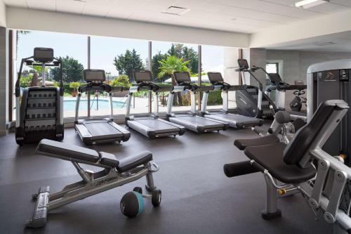 a gym with a bunch of treadmills and machines at Hyatt Regency San Francisco Airport in Burlingame