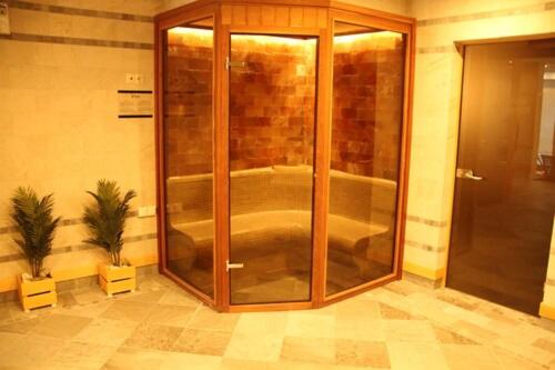 a shower with a glass door in a room at 7 Pools SPA Boutique Hotel in Bansko