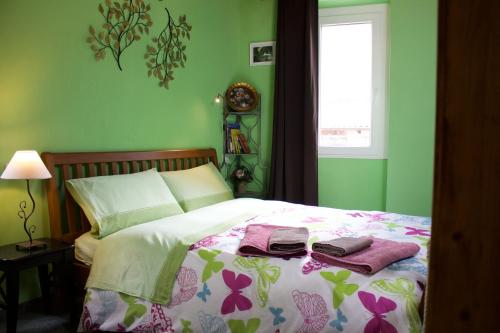 a bedroom with a bed with two towels on it at La Casa Sul Sasso in Dervio