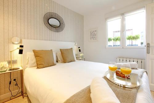 Postel nebo postele na pokoji v ubytování Sofia Suites