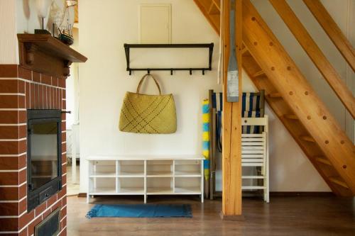 a living room with an attic with wooden beams at ATMA Domki in Bobolin