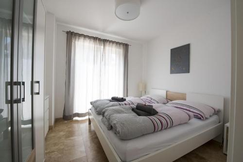 Un pat sau paturi într-o cameră la Ferienwohnungen Ebenzweier