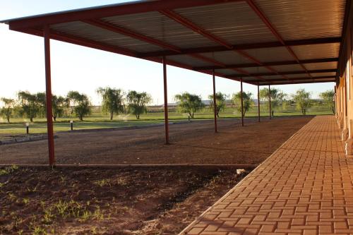 an empty parking lot with a pavilion in a park at Nations Lodge in Lynchfield