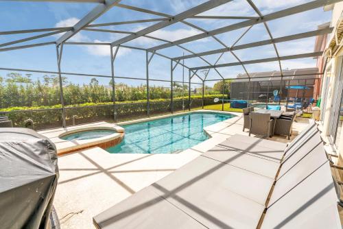 Disney Dream with Hot Tub, Pool, Xbox, Games Room, Lakeview, 10 min to Disney, Clubhouse photo 14