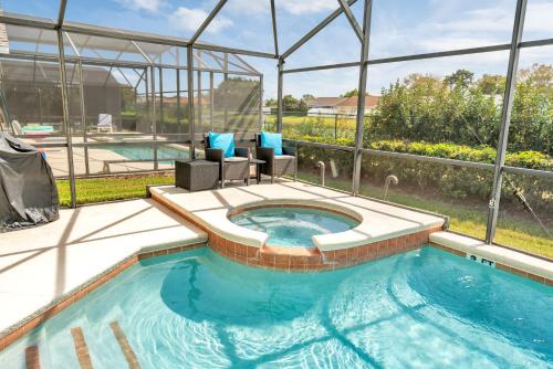 Disney Dream with Hot Tub, Pool, Xbox, Games Room, Lakeview, 10 min to Disney, Clubhouse photo 17